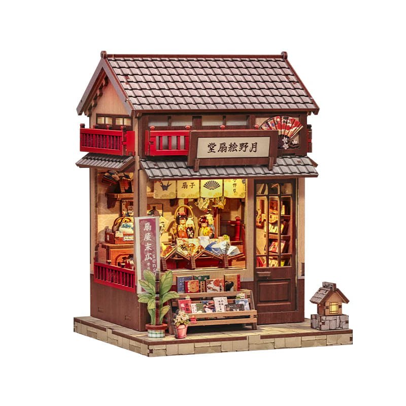 Book Nook tienda de abanicos japonesa colocado en estantería con libros