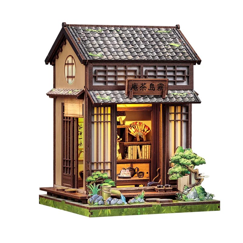 Book Nook Casa de Té Japonesa colocado en una estantería con libros