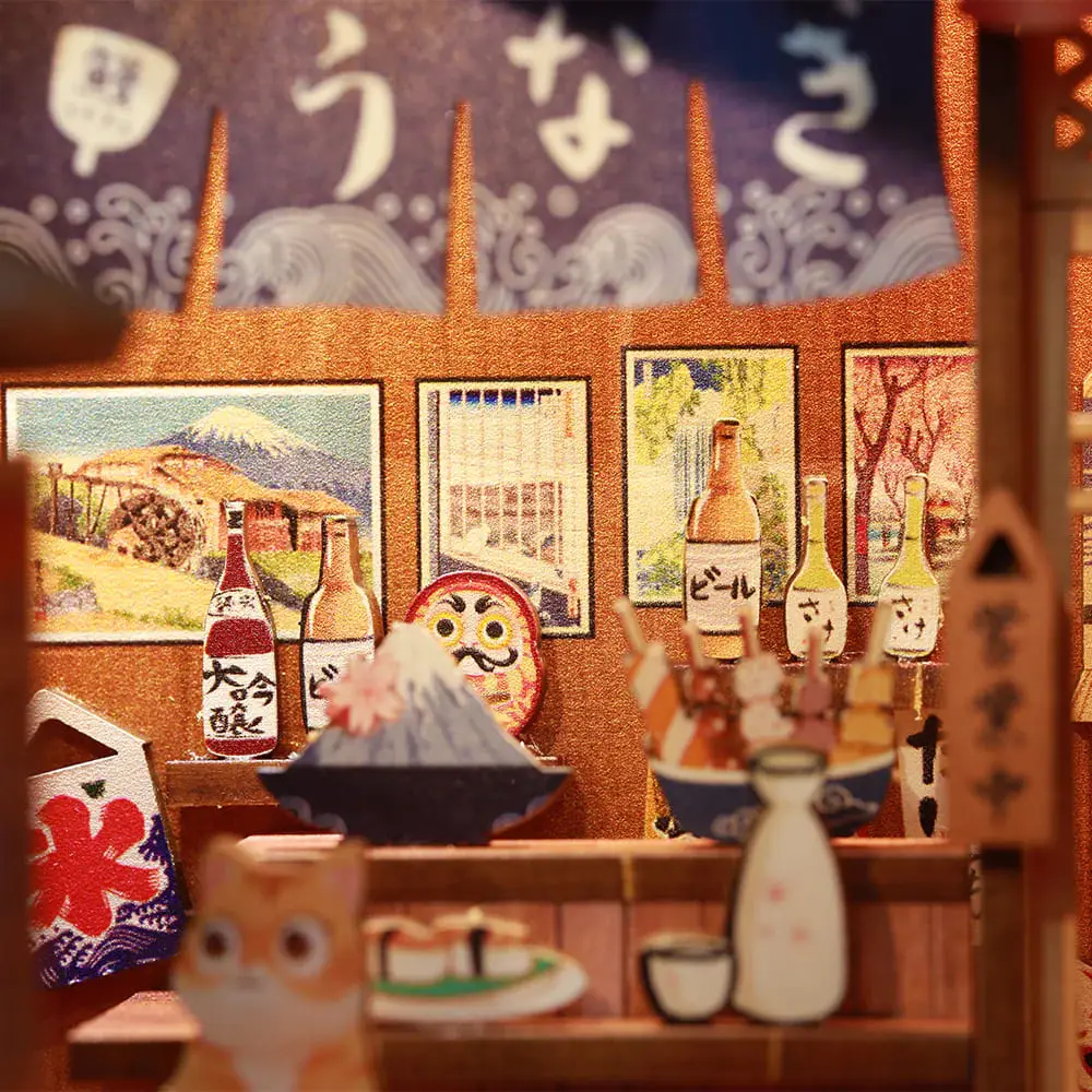 Book Nook Sakura iluminado de noche en una estantería