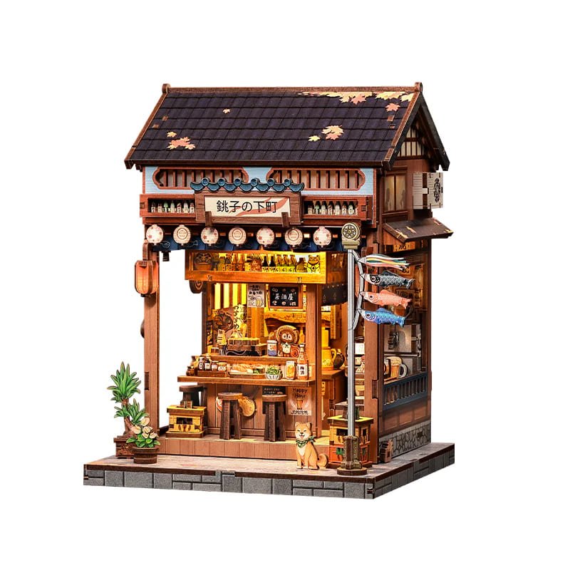 Book Nook Izakaya montado con barra y botellas de sake